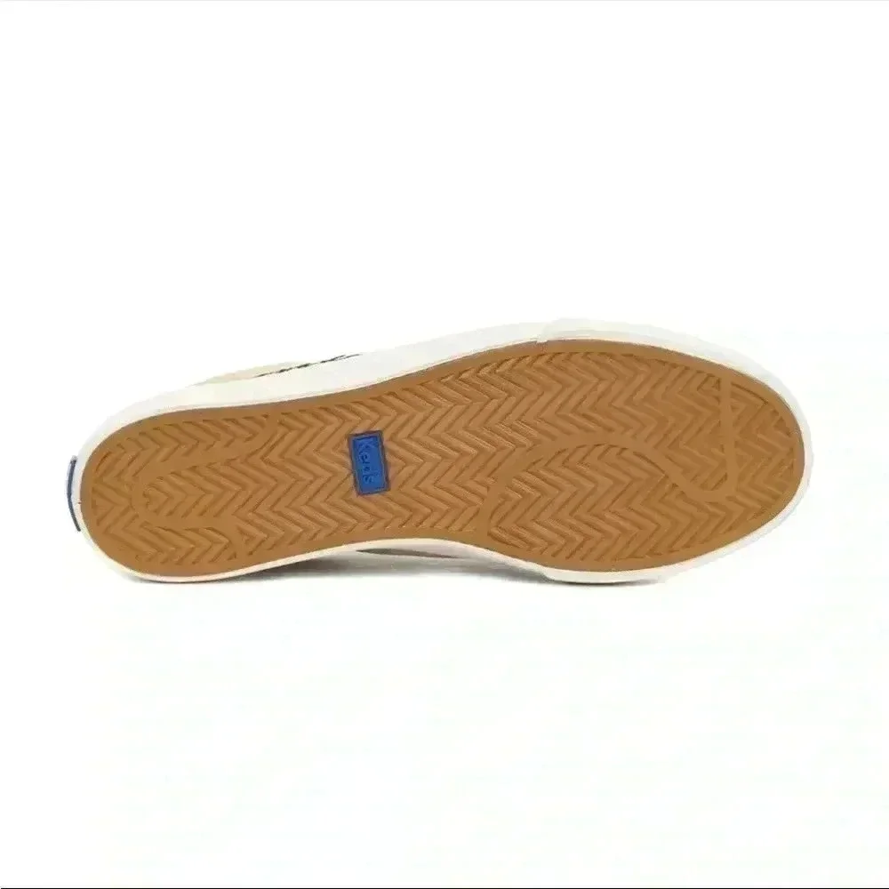 Keds beige canvas sneakers with black trim and leopard heel